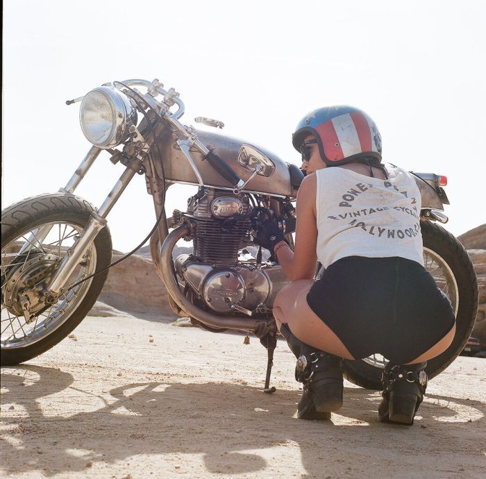 A playful frame from Girls on a motorcycle — online in Chennai
